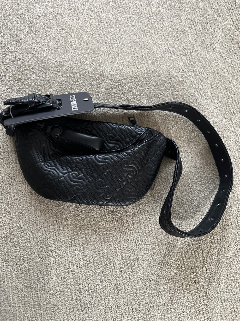 NWT Steve Madden fanny pack with a quilted logo design and an adjustable strap